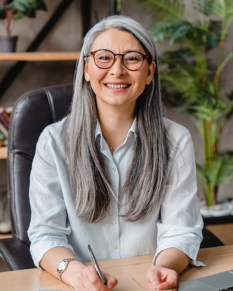 vertical shot of a successful middle aged woman at d86xszb.jpg